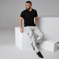 Load image into Gallery viewer, The Ankh Joggers in White by KonectKemet feature the iconic Egyptian Ankh symbol celebrating African heritage. Comfortable fit, premium fabric, made on demand. African diaspora streetwear at konectkemet.com

