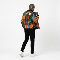 Load image into Gallery viewer, Man walking looking back in Ashanti Bomber — Kente — African streetwear bomber jacket back view KonectKemet
